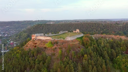 The ruins of Kremenets Castle on a hill from a bird's eye view. Filmed in UHD 4k drone video. photo