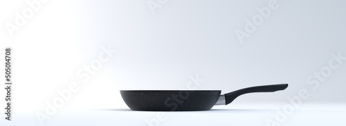 Obraz na plátně Black teflon frying pan in the studio on a white background