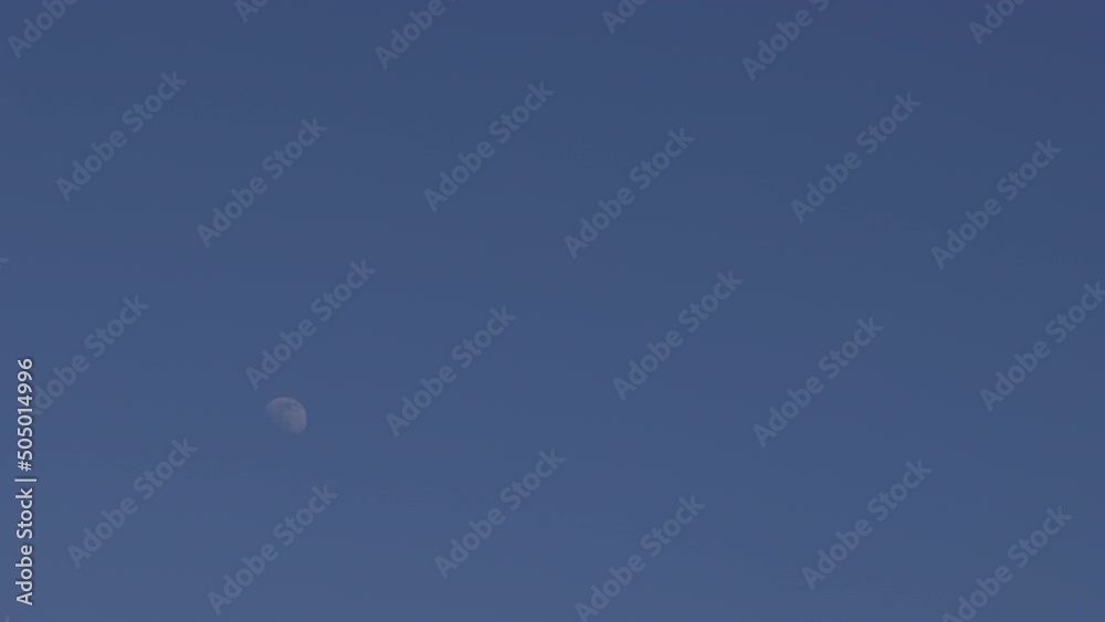 the moon moves across the blue sky timelapse the moon moves across the blue sky timelapse