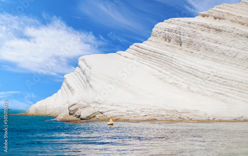 Scala dei Turchi (Italy) - The very famous white rocky cliff on the coast in the municipality of Porto Empedocle, province of Agrigento, Sicily, with beatiful golden beach and blue sea. photo