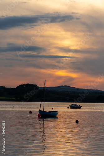 Boats moored in the River Exe as seen from Lympstone village in Devon, UK