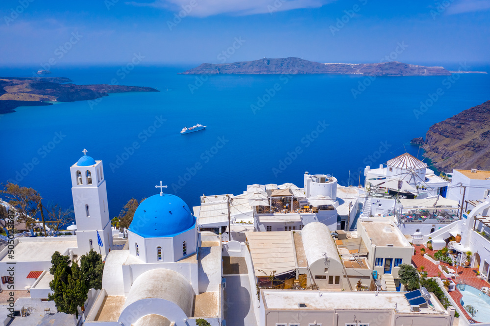 Obraz premium view of Fira, caldera, volcano of Santorini, Greece with cruise ships