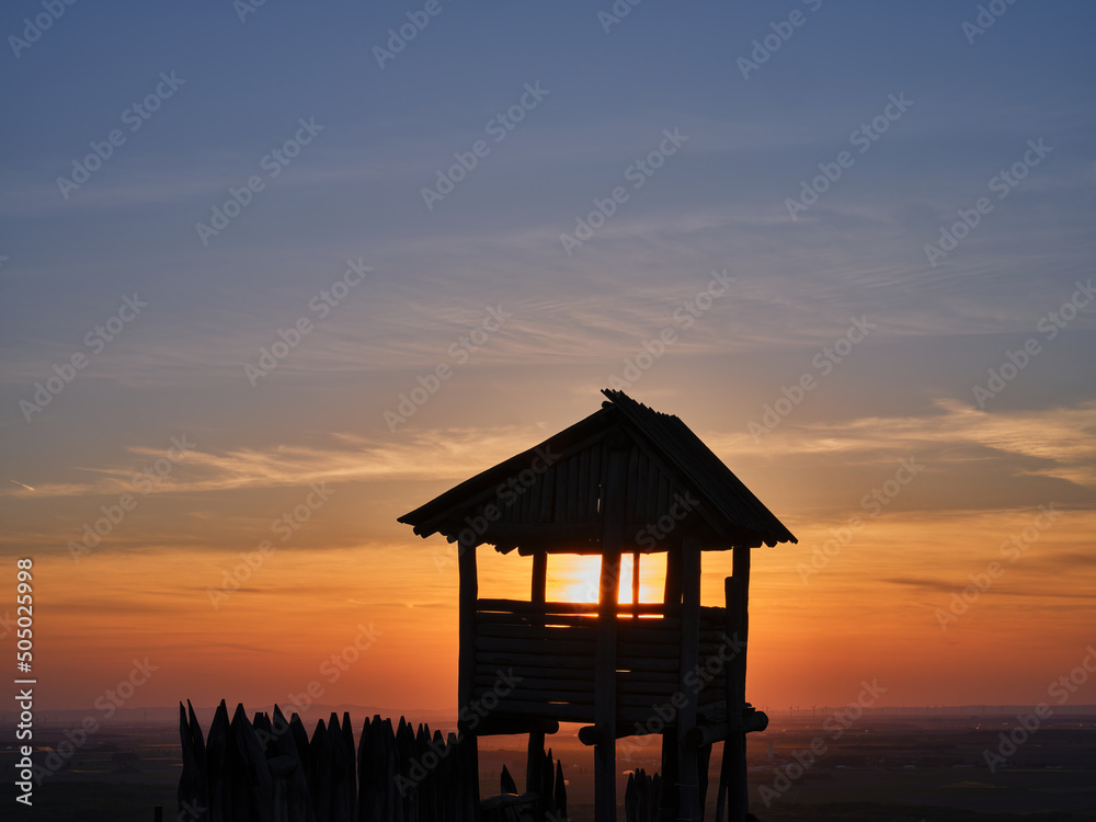 Wooden lookout tower and sunset at Braunsberg, Austria