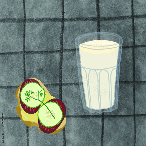 Snack: a glass of kefir and a sandwich with sausage and cucumbers.