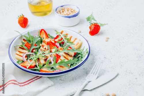 Grilled halumi salad with pine nuts, strawberries and arugula.