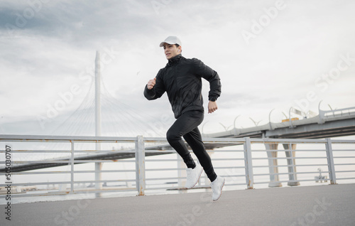 Male athlete runner training to run fast on the street in sportswear © muse studio