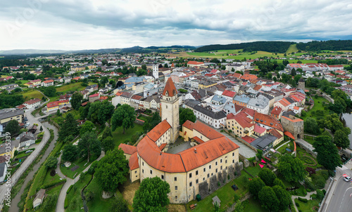 Drone view of the Altstadt Freistadt square. Old church, clock tower on the square in Austria, Tyrol photo