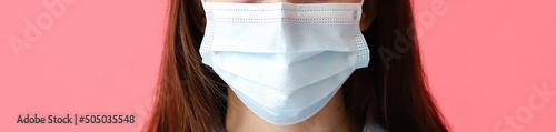 Young woman wearing medical...