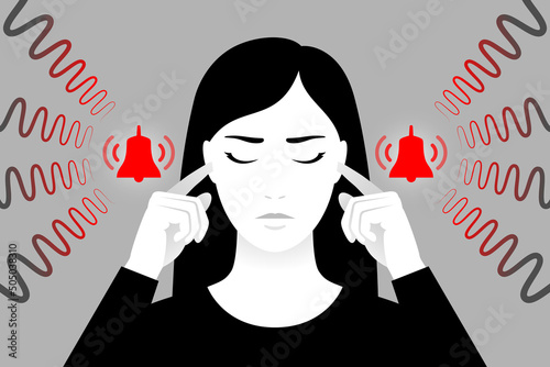 Woman is plugging her ears with fingers, suffering from tinnitus