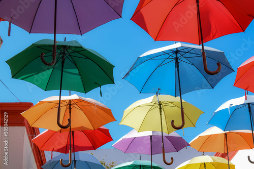 Colored umbrellas in the sky