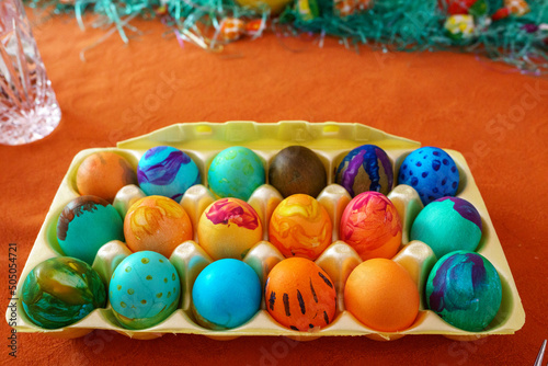 фотографія Carton of homemade dyed Easter eggs