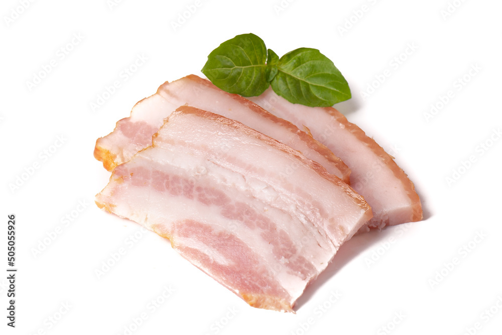 Raw pieces of fresh bacon with basil leaf green isolated on a white background. Raw pieces of fresh bacon with basil leaf green isolated on a white background.