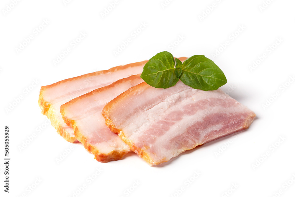 Raw pieces of fresh bacon with basil leaf green isolated on a white background.