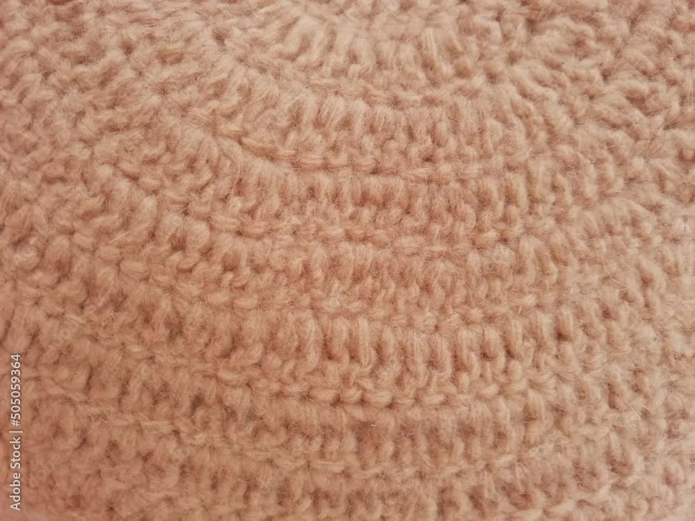 close up of a knitted wool moving close up of a knitted wool moving