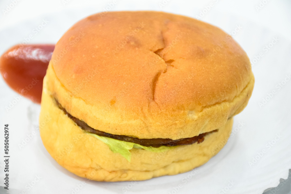 Vegetarian hamburger with fries and red chilli sauce on white background Vegetarian hamburger with fries and red chilli sauce on white background