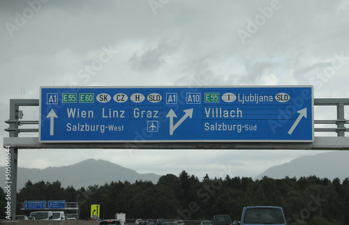 Road sign near the Border between Italy and Austria ans slovenia  with name of the City WIEN LINZ GRAZ and VILLACH photo