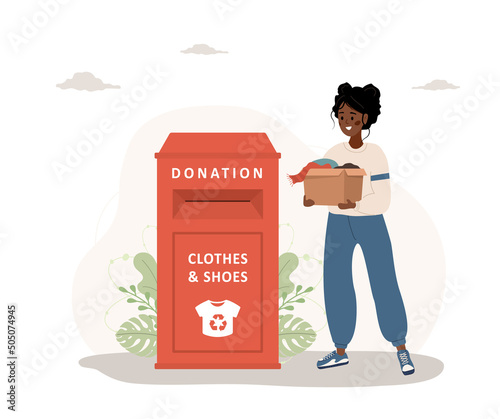 Clothes donation. African woman with cardboard box gives things for recycling or donated. Clothing bin or recycle container. Volunteering and social care. Vector illustration in flat cartoon style.