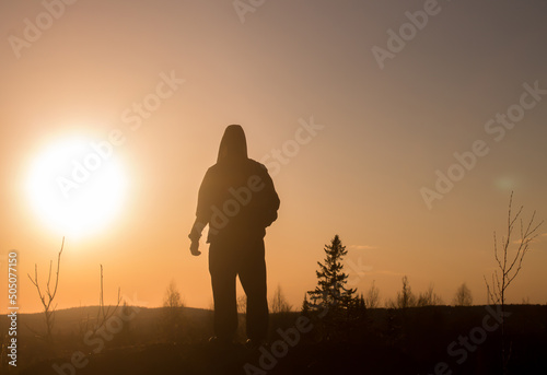 silhouette of a person in the sunset