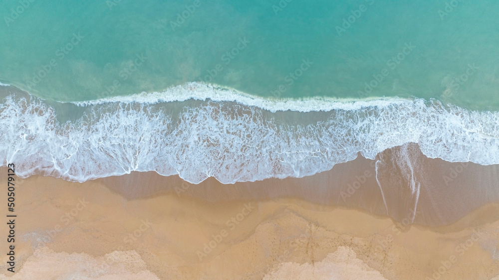 Aerial view  summer with seascape as beach waves from the Top view by drone. Travel concept