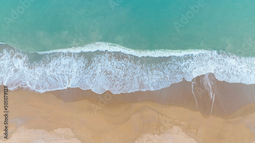 Aerial view summer with seascape as beach waves from the Top view by drone. Travel concept