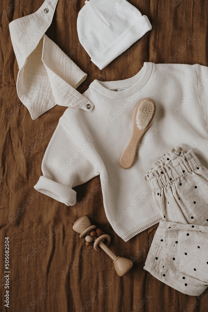 Flatlay aesthetic Scandinavian newborn baby clothes, accessories