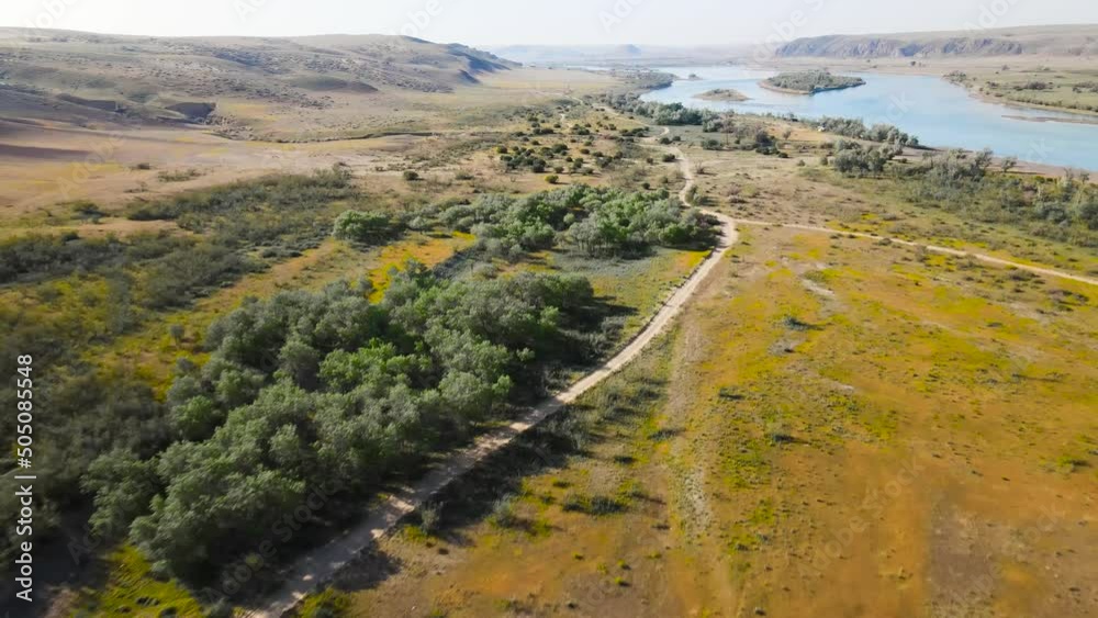 Drone shot of river Ili and spring steppe in Kazakhstan