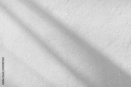 Sunlight shadow on abstract white concrete cement wall background texture