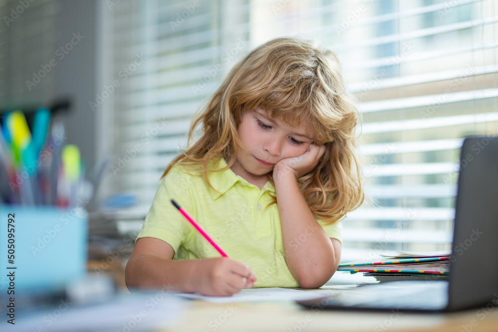 Tired schoolboy while doing homework. Child writing homework in school class. Funny child girl doing homework writing and reading at home. Little student at desk in school classroom. Tired schoolboy while doing homework. Child writing homework in school class. Funny child girl doing homework writing and reading at home. Little student at desk in school classroom.