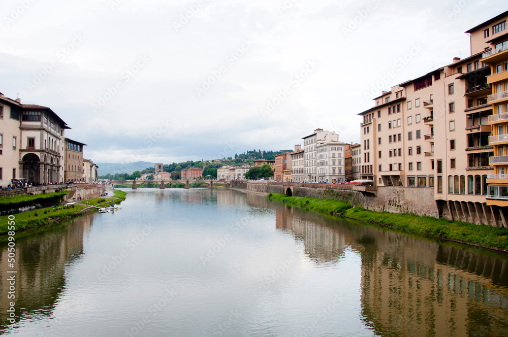 Florence waterfront with Ponte alla Grazie bridge over Arno river in Italy