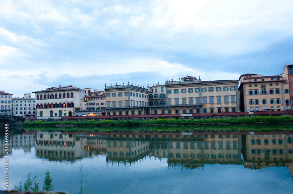 Florence waterfront with Ponte alla Carraia bridge over Arno river in Italy