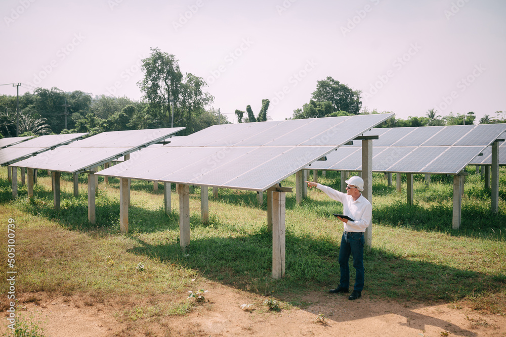 Solar power plant. Engineers Went to check the operation of the system Solar Farm. Renewable energy to conserve the world's energy Photovoltaic module concept for clean energy generation. Solar power plant. Engineers Went to check the operation of the system Solar Farm. Renewable energy to conserve the world's energy Photovoltaic module concept for clean energy generation.