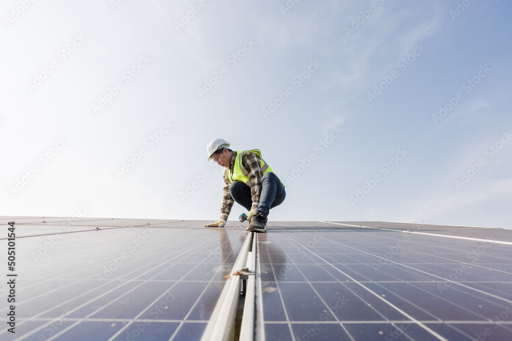 worker installing the solar panels.Solar power energy. renewable energy, Solar power plant. worker maintenance of solar power plants who perform inspections and maintenance of solar power plants. worker installing the solar panels.Solar power energy. renewable energy, Solar power plant. worker maintenance of solar power plants who perform inspections and maintenance of solar power plants.