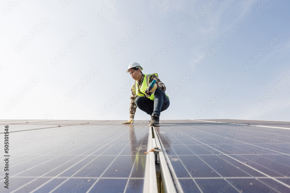 worker installing the solar panels.Solar power energy. renewable energy, Solar power plant. worker maintenance of solar power plants who perform inspections and maintenance of solar power plants. worker installing the solar panels.Solar power energy. renewable energy, Solar power plant. worker maintenance of solar power plants who perform inspections and maintenance of solar power plants.