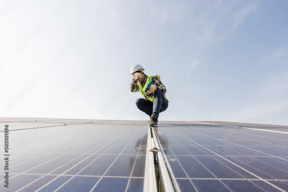 worker installing the solar panels.Solar power energy. renewable energy, Solar power plant. worker maintenance of solar power plants who perform inspections and maintenance of solar power plants. worker installing the solar panels.Solar power energy. renewable energy, Solar power plant. worker maintenance of solar power plants who perform inspections and maintenance of solar power plants.