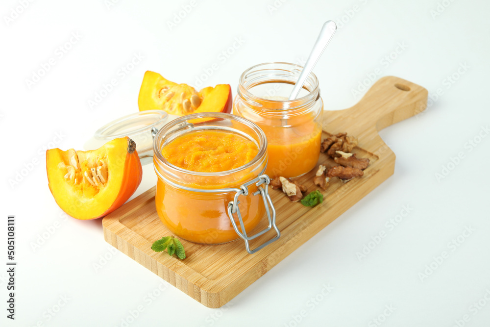 Concept of tasty food, pumpkin jam on white background Concept of tasty food, pumpkin jam on white background