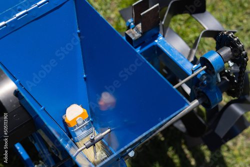  Agricultural machinery. Close-up of technical units and mechanisms of agricultural machinery. Grain feed elements photo