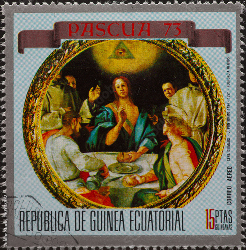 Equatorial Guinea - CIRCA 1973: a postage stamp from Equatorial Guinea , showing Christ at Emmaus (Pontormo) . Circa 1973 photo