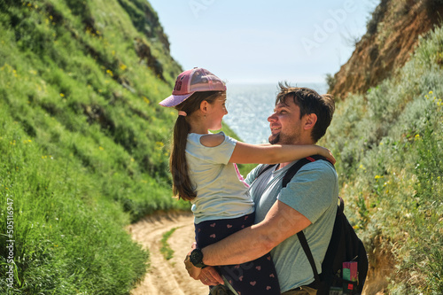 Cropped image of happy father and daughter in green hills