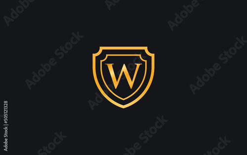 Double shield and golden elegant logo design vector with the letter W