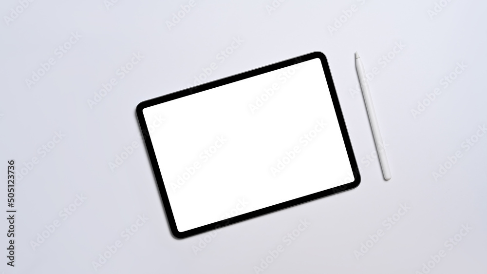 Flat lay digital tablet with empty display and stylus pen on white background Flat lay digital tablet with empty display and stylus pen on white background