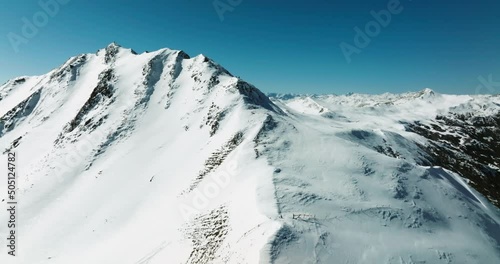 snow covered mountains ubder blue sky photo