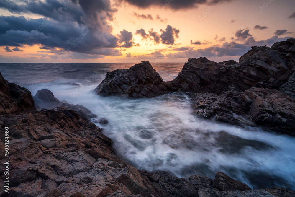 Magnificent colorful seascape with picturesque rocks in sunrise time