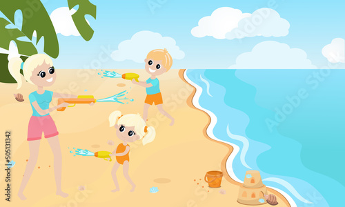 Children and mother or sister play on the beach and have a water battle with water guns. The mood of summer holidays and fun.