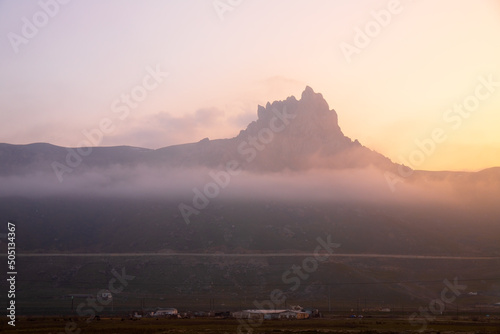 Sacred mountain Beshbarmag at sunset.