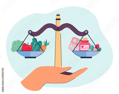 Person deciding between natural and artificial vitamins. Hand holding scale with vegetables and fruits and pills on it. Health, decision concept for banner, website design or landing web page