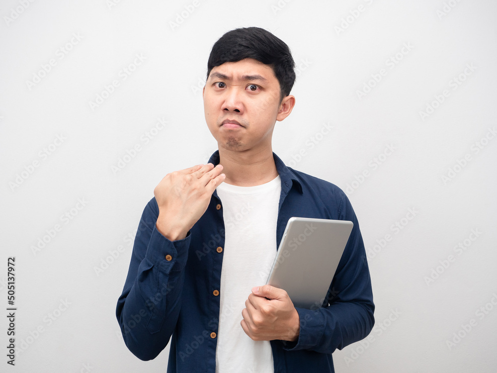 Man holding tablet serious face gesture cut his neck