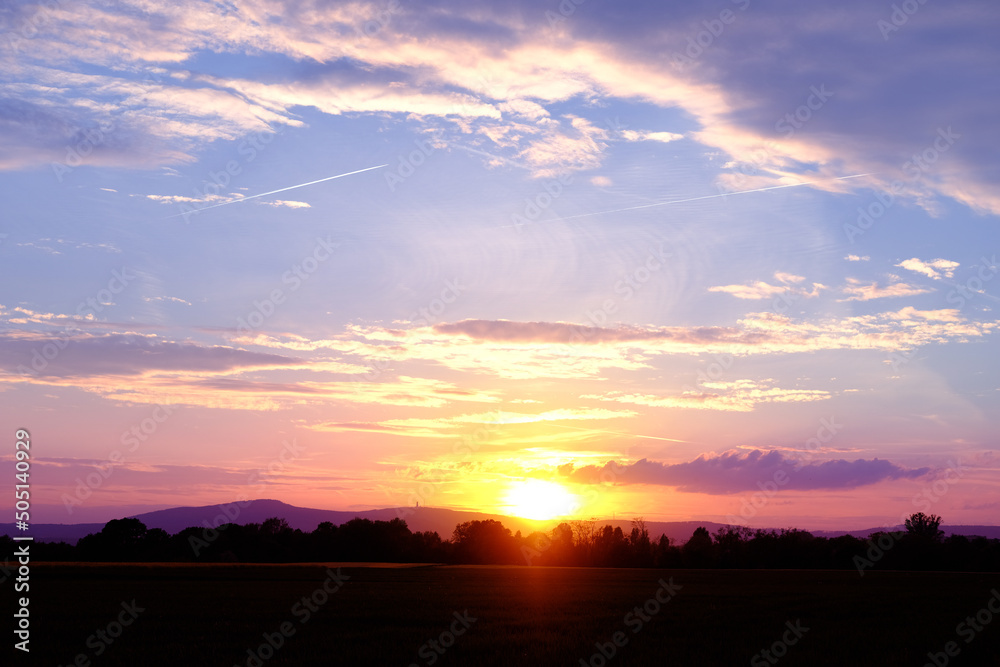 sunset in evening beautiful dramatic sky with cloud, background light sky gradient, concept of heavenly space, abode of God, meditative calmness and greatness, black silhouette of hills at bottom