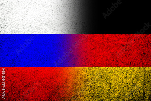 The national flag of Germany with National flag of Russian Federation. Grunge background