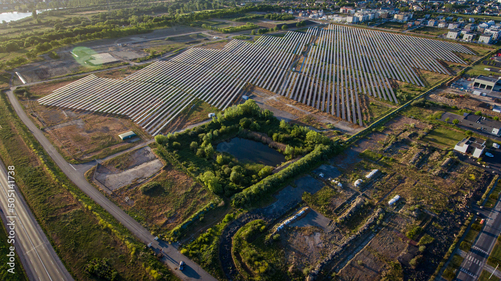 Colombelles industrial zone top view, solar panel farm in the distance, symbol of transformation, green enargia, top view drone photo