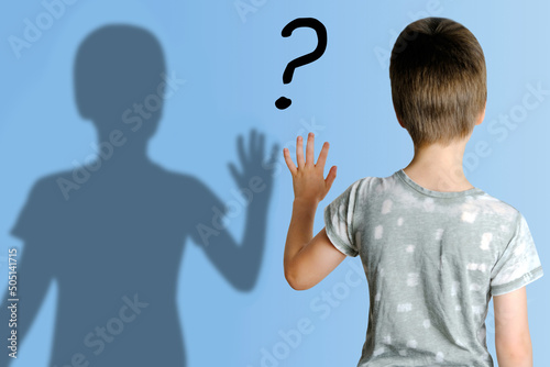 Bilde på lerret child 8-10 years old in gray t-shirt extended his hand to his shadow, concept im